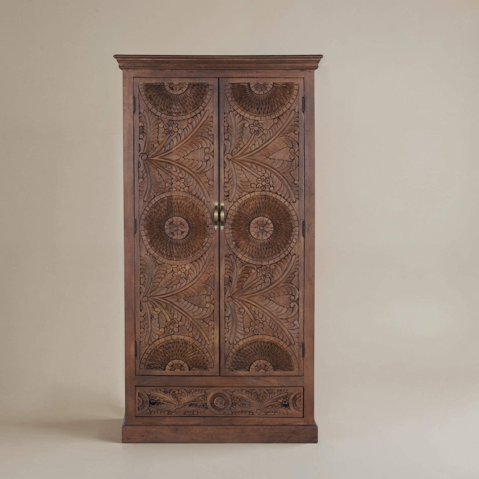 Sienna hand-carved solid mango wood armoire, front view with two carved doors and drawer in warm walnut-brown finish