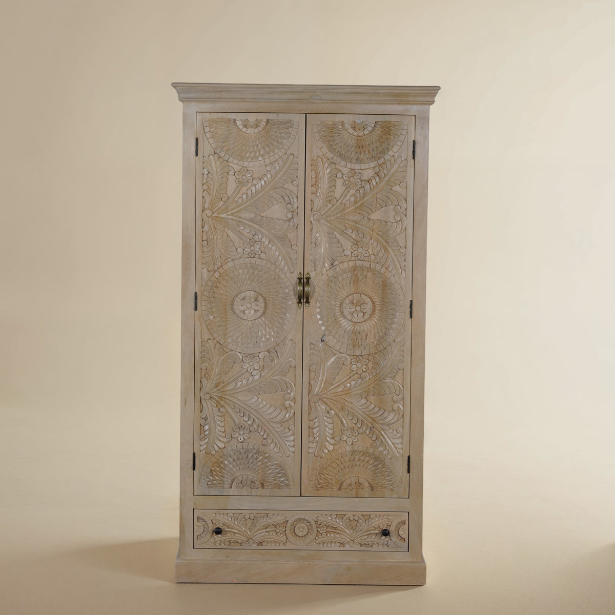 Birch hand-carved mango wood armoire, angled studio view in natural beige